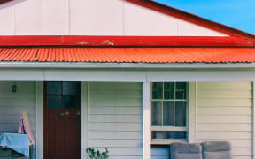 Album cover for Street Chant's Hauora, showing the front of an old railway cottage.