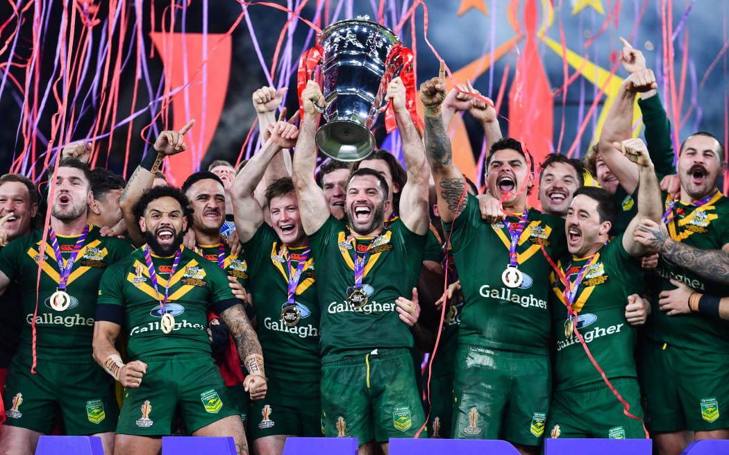James Tedesco of Australia lifts the Men’s 2021 Rugby League World Cup after victory over Samoa