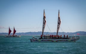 The waka flotilla arrives in the bay as part of the Tuia 250.