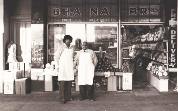 Bhana Fakir (right) poses for a photo with his son Narendra outside Bhana Brothers in Ponsonby.