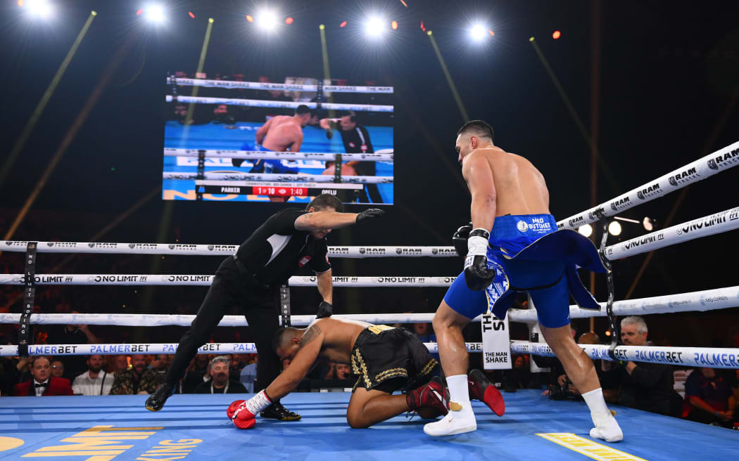 Joseph Parker looks on after knocking Faiga Opelu down, Melbourne 2023.