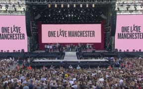 Those gathered at the One Love Manchester benefit concert have a minute's silence before the concert begins.
