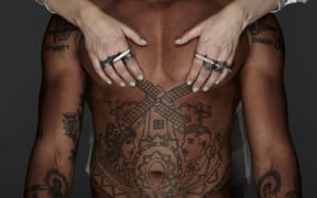 I Love Ugly attempted to appease critics by releasing a new series of images featuring a clothed woman on a naked man’s chest.
