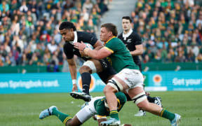 Tupou Vaai is tackled by Jasper Wiese.