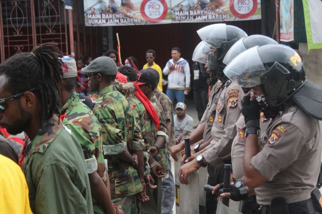 West Papuan demonstrators tightly monitored by Indonesian police.