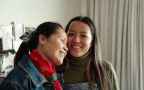 (L-R) Hương and daughter Hà