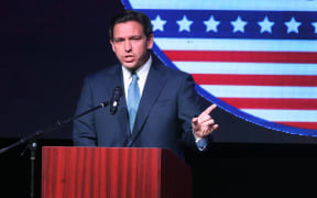 ROTHSCHILD, WISCONSIN - MAY 06: Florida Governor Ron DeSantis speaks to guests at the Republican Party of Marathon County Lincoln Day Dinner annual fundraiser on May 06, 2023 in Rothschild, Wisconsin. Although he has not yet announced his candidacy, DeSantis is expected to be among the top contenders vying for the Republican presidential nomination next year.   Scott Olson/Getty Images/AFP (Photo by SCOTT OLSON / GETTY IMAGES NORTH AMERICA / Getty Images via AFP)