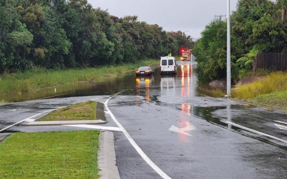 The scene of flooding in Mangawhai where a car got stuck after surface flooding.