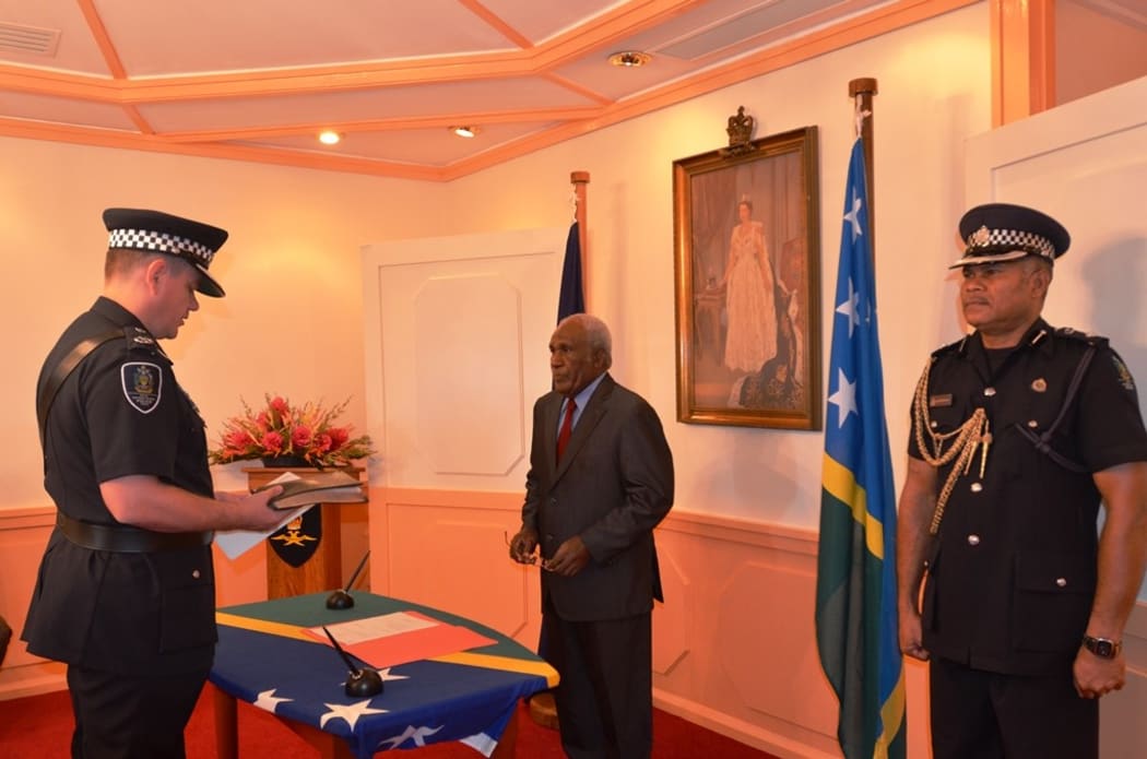 Matthew Varley is sworn in as Solomon Islands police commissioner.