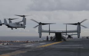 Osprey aircraft take off from the deck of amphibious assault ship the USS Bonhomme Richard during the Talisman Sabre exercise