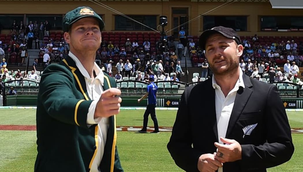 Captains Steve Smith (Australia) and Brendon McCullum (New Zealand) make the toss in the inaugural day-night cricket test,