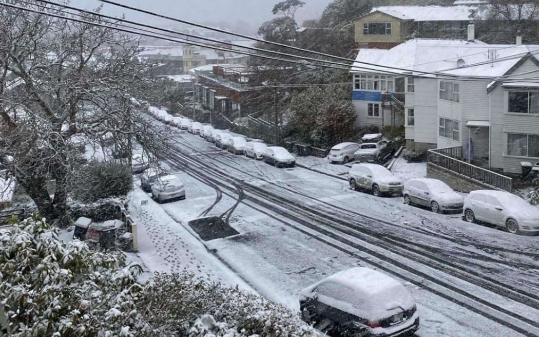 Snow settled on cars in Regent Street, Dunedin, Thursday 6 October 2022