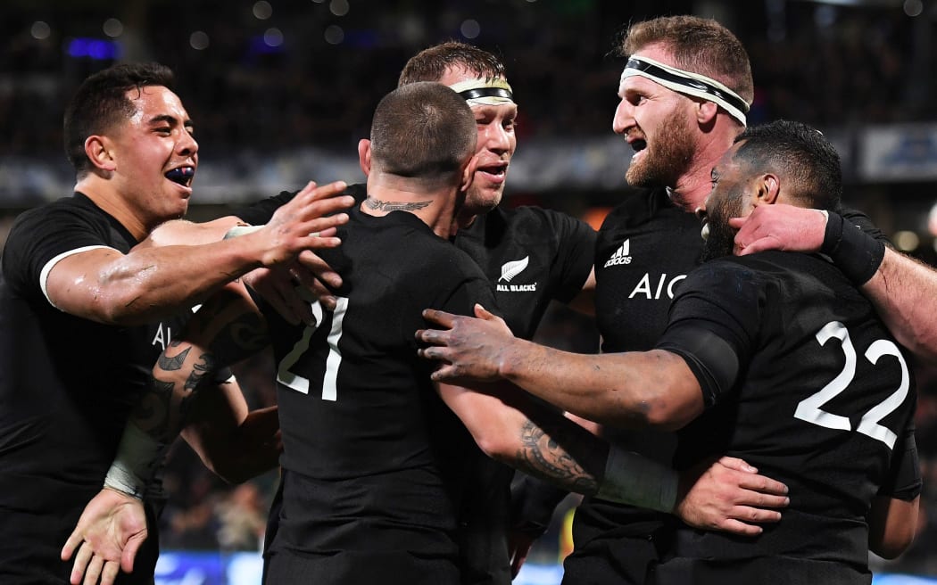 Lima Sopoaga celebrates his try with Kieran Read and team mates.
