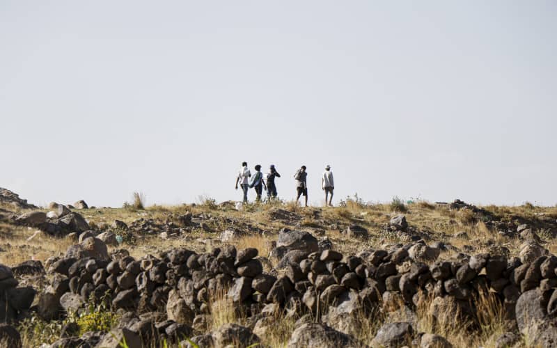 Ethiopian migrants Caption: Ethiopian migrants who are seeking political asylum or just a better life walk along a highway to Saadah province to cross into Saudi Arabia, on August 23, 2023 on the outskirts of Sana’a, Yemen. Mandatory Credit: Mohammed Hamoud/Getty Images via CNN Newsource