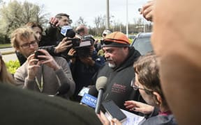 Jesus Campos, a worker originally from El Salvador, speaks about his coworkers who were working on the night shift while repairing the Francis Scott Key Bridge at the time of the accident when it collapsed after a Singapore-flagged container ship called the Dali collided with it along a shipping channel in Baltimore, Maryland, on March 26, 2024. The bridge collapsed early March 26 after being struck by the Singapore-flagged Dali container ship, sending multiple vehicles and people plunging into the frigid harbor below. There was no immediate confirmation of the cause of the disaster, but Baltimore's Police Commissioner Richard Worley said there was "no indication" of terrorism. (Photo by ROBERTO SCHMIDT / AFP)