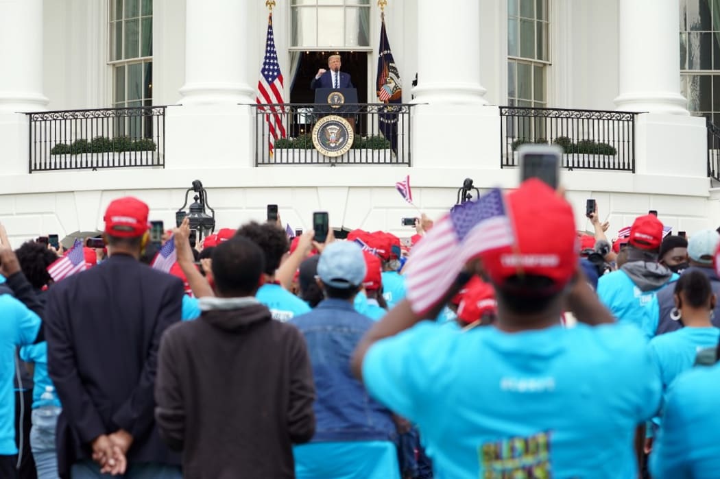 US President Donald Trump speak about law and order to supporters from the South Portico of the White House in Washington, DC, on October 10, 2020. -