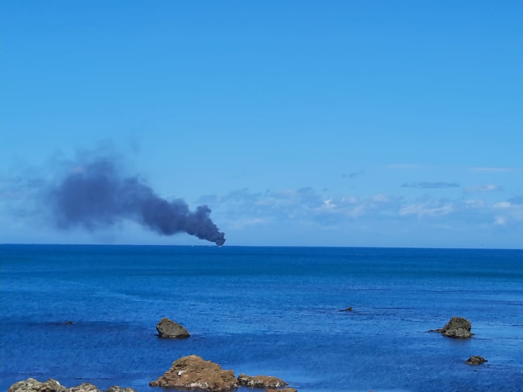 A motor launch on fire off Wellington's South Coast
