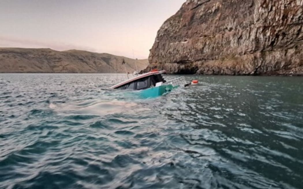 A nearly submerged boat off the coast of Akaroa, Banks Peninsula.