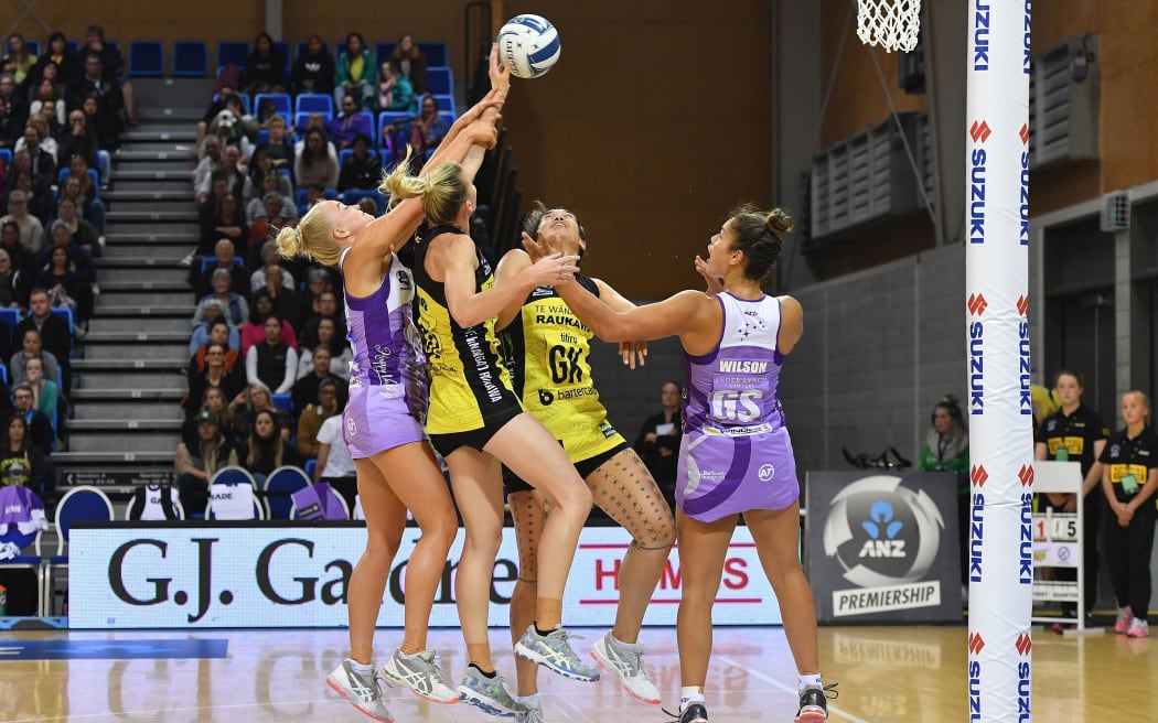 Stars Charlee Hodges takes a shot at goal with team mate Maia Wilson with Pulse's captain Katrina Rore and Sulu Fitzpatrick during the ANZ Premiership netball match.