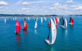 Sails crowd the water at the start of the island racing event during Bay of Islands Sailing Week 2024.
