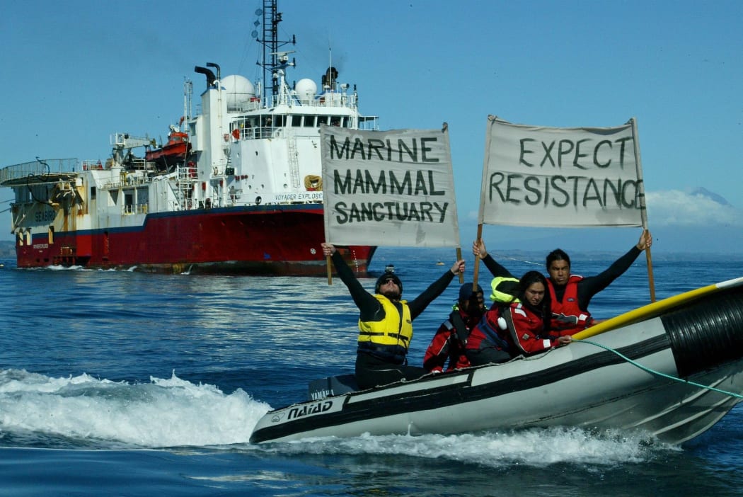Protestors demonstrate before a prospecting vessel in Taranaki