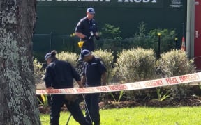 Police search the scene of a death in Auckland's Blockhouse Bay in August 2024.