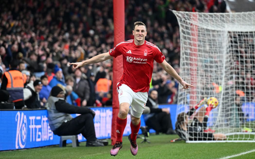 Chris Wood celebrates scoring his team's third goal during the Premier League match between Nottingham Forest FC and Brighton & Hove Albion FC.