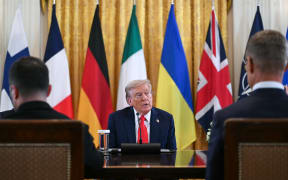 Ukrainian President Volodymyr Zelensky (L) and Finnish President Alexander Stubb (R) look on as US President Donald Trump (C) speaks during a meeting with European leaders in the East Room of the White House in Washington, DC, on August 18, 2025. European leaders join Ukrainian President Volodymyr Zelensky in talks with US President Donald Trump on August 18, as they try to find a way to end Russia's offensive.  The leaders heading to Washington on Monday to appear alongside Zelensky call themselves the "coalition of the willing." (Photo by ANDREW CABALLERO-REYNOLDS / AFP)