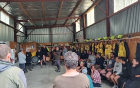 A meeting at the Putorino Fire Station three days after cyclone. Max Tweedie says they punched through slips to connect people together.