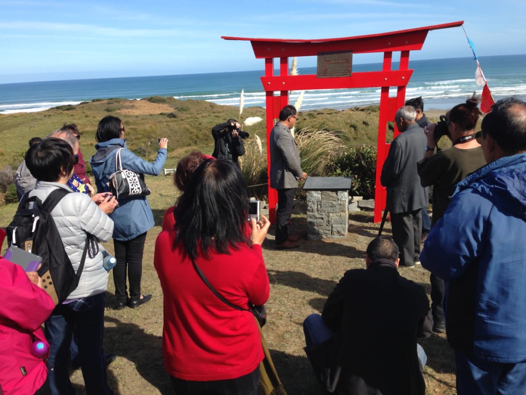 Visitors at the Memorial Gate at Mitimiti.