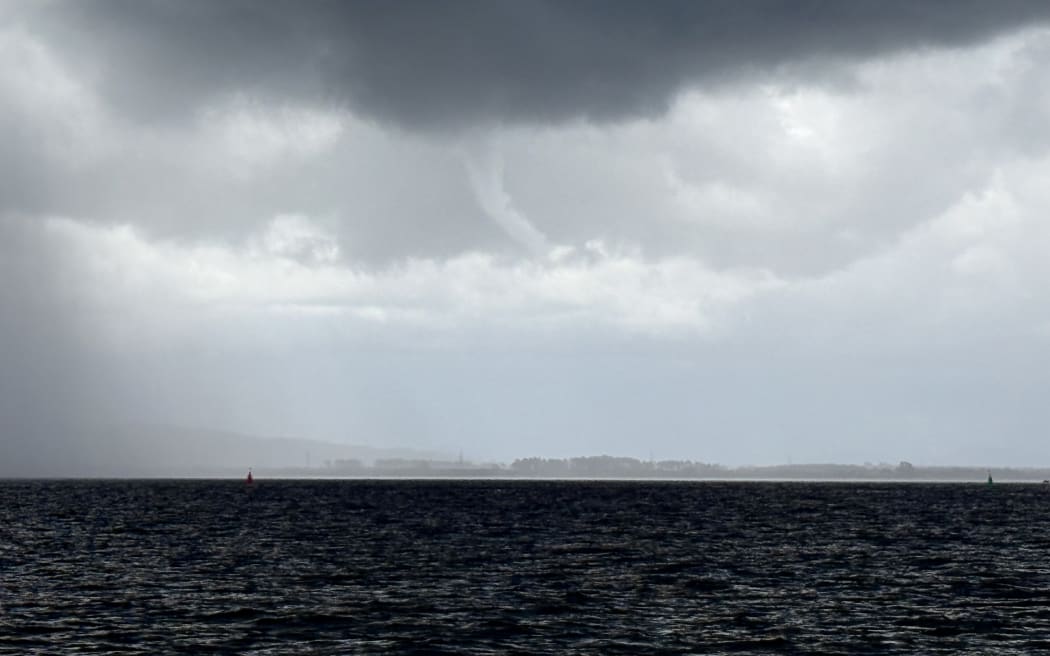 A second waterspout was captured in the approaching storm.