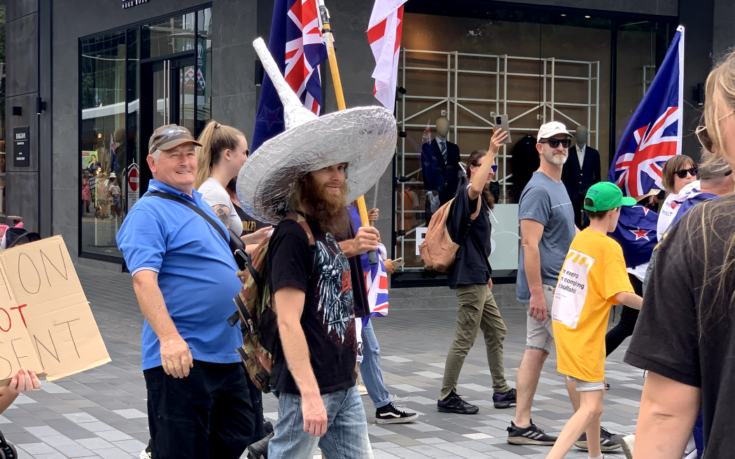 A protester in a tinfoil hat at the anti-mandate demonstration in Christchurch.