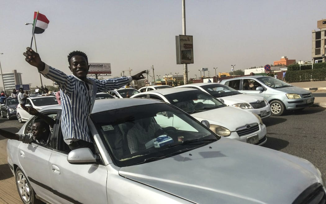 A Sudanese man celebrates.