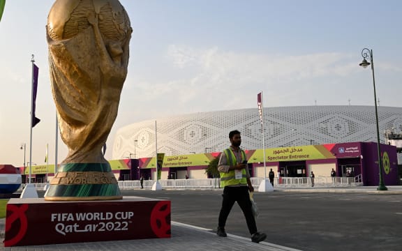 A man walks outside the Al-Thumama Stadium in Doha on November 8, 2022, ahead of the Qatar 2022 FIFA World Cup football tournament. (Photo by Kirill KUDRYAVTSEV / AFP)