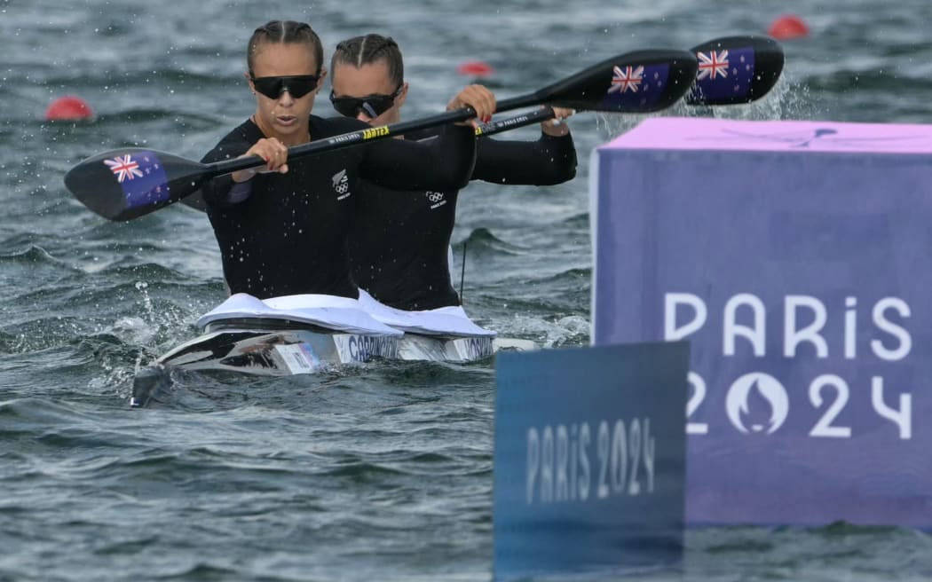 Lisa Carrington of New Zealand (L) and Alicia Hosking of New Zealand compete in the women's double kayak 500m semi-final in the canoe sprint event at the Verne Nautical Stadium in Vers-sur-Marne on August 9, 2024 during the Paris 2024 Olympic Games. (Photo by Bertrand GUAY/AFP)