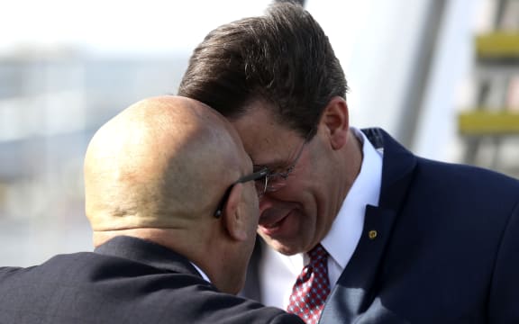 New Zealand Defence Minister Ron Mark receives US Secretary of Defense Mark Esper (R) at Auckland International airport on August 5, 2019. - Esper is in New Zealand for two days to hold bilateral meetings.