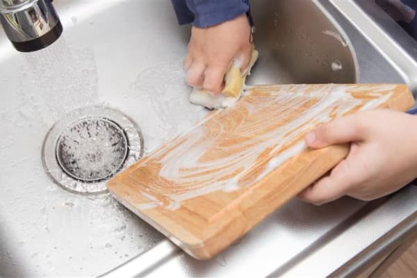 Cleaning boards by hand with hot, soapy water is recommended for all types of cutting boards.