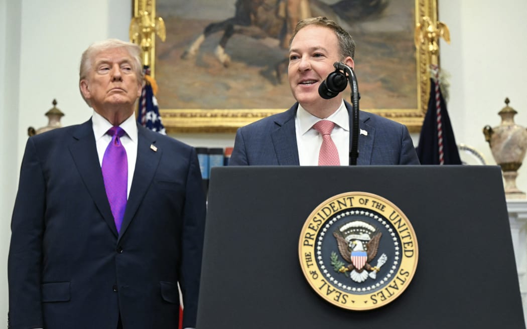 US President Donald Trump listens as US Administrator of the Environmental Protection Agency, EPA, Lee Zeldin (R)
speaks as they make an announcement in the Roosevelt Room of the White House in Washington, DC on February 12, 2026.. President Donald Trump on Thursday revoked a landmark scientific finding that underpins US regulations aimed at curbing planet-warming pollution, marking the administration's most far-reaching rollback of climate policy to date. (Photo by SAUL LOEB / AFP)