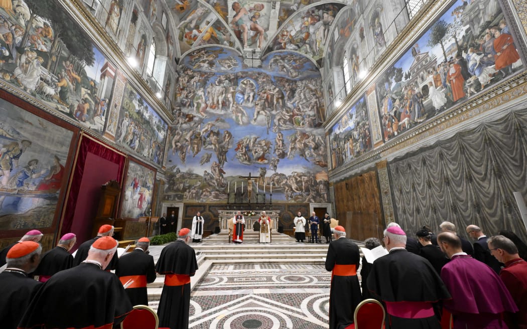 This photo taken and handout on October 23, 2025 by The Vatican Media shows Britain's King Charles III and Britain's Queen Camilla during an Eucumenical prayer led by Pope Leo XIV in the Sistine Chapel in The Vatican.