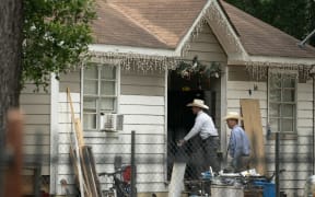 Law enforcement respond to a crime scene where five people, including an 8-year-old child, were killed after a shooting inside a home in Cleveland, Texas on 29 April, 2023. The alleged gunman, who is not yet in custody, used an AR-15 style rifle to shoot his neighbours.