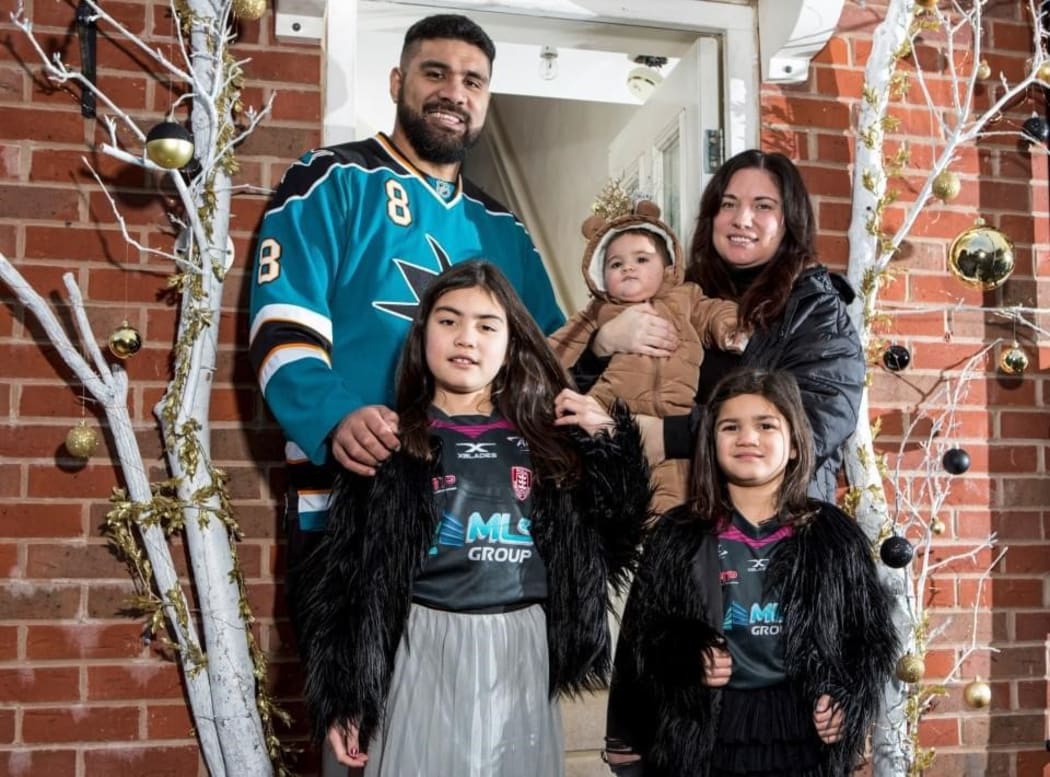 Mose Masoe and his family nearly a year after his accident.