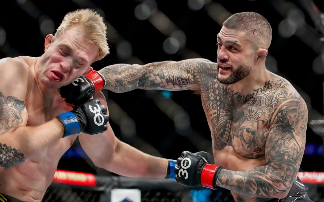 Tyson Pedro hits Anton Turkalj with a big right hand. UFC 293, Qudos Bank Arena, Sydney Olympic Park Australia, Sunday 10th September 2023.  Copyright Photo: David Neilson / www.photosport.nz