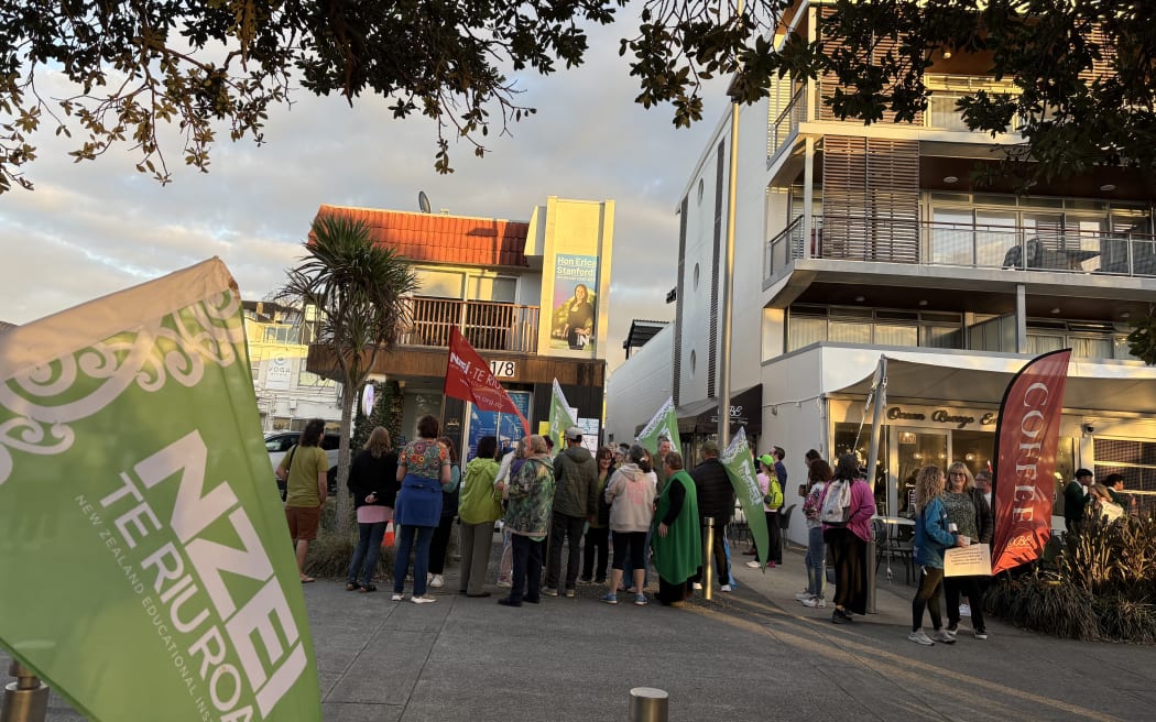 School staff gathering outside Education Minster Erica Stanford’s office in Browns Bay, Auckland to protest.