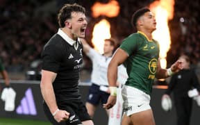 Leroy Carter of New Zealand celebrates a try.