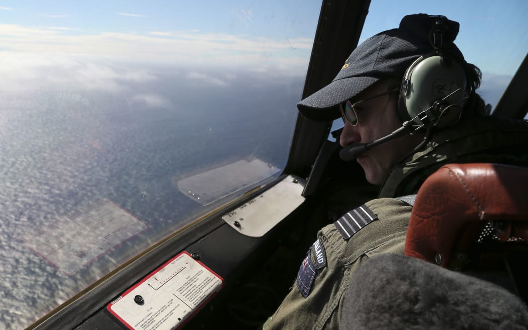 RNZAF Orion captain Wing Commander Rob Shearer scans the search area.