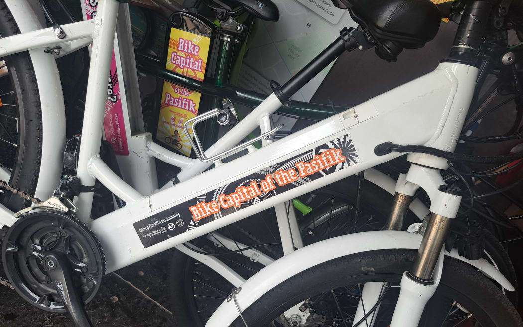 Bike with Triple teez messaging on its side.