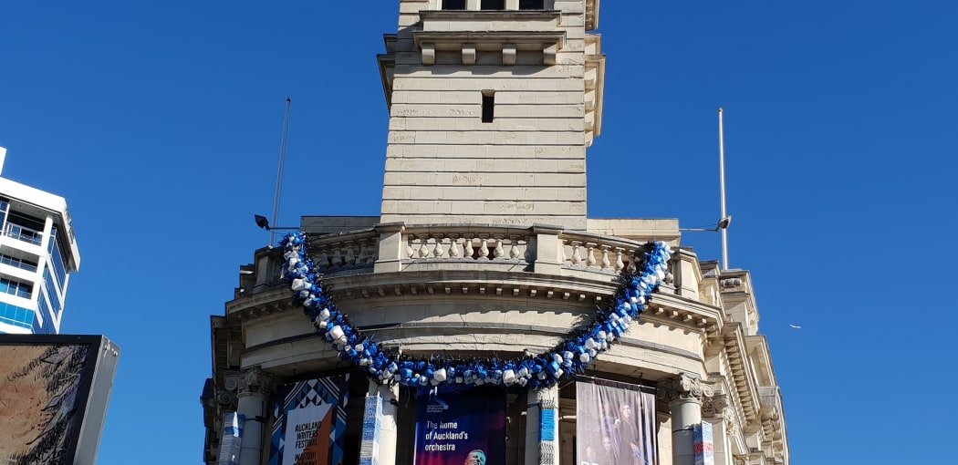 The Ei hangs on the Auckland Town Hall clock tower.