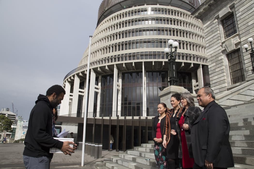 Pala Molisa and Tere Harrison present a petition on West Papua to New Zealand MPs Marama Davidson, Lousia Wall, Catherine Delahunty and Su'a William Sio, outside the country's parliament. 6 September 2016.