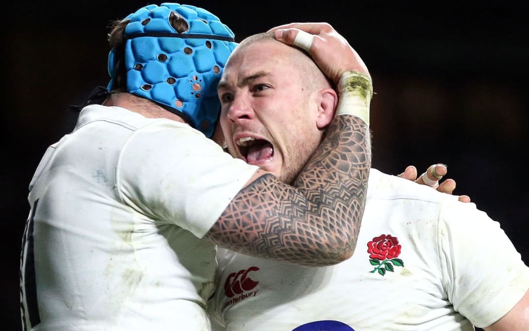 Mike Brown of England celebrates scoring a try.