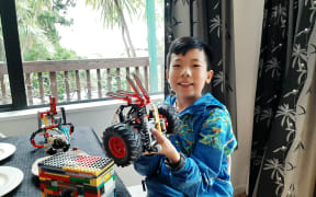 11 year old Ding Ding shows off his Lego creations.
